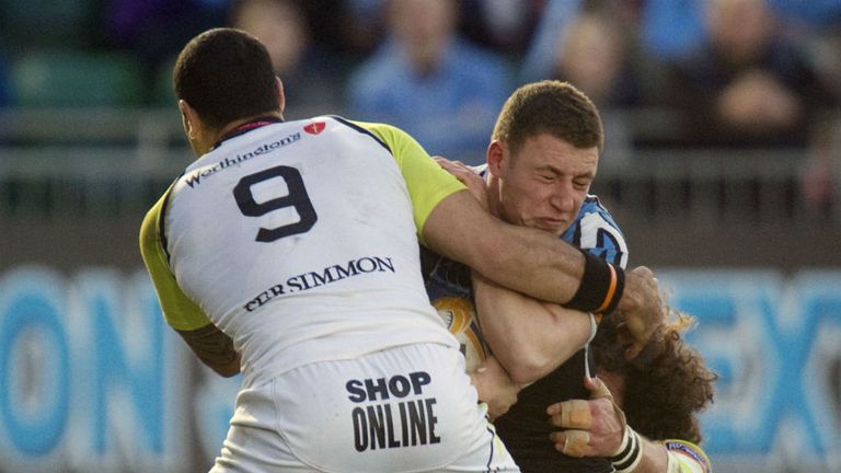 Glasgow fly-half Duncan Weir right is shackled by Ospreys' Kahn Fotuali'i